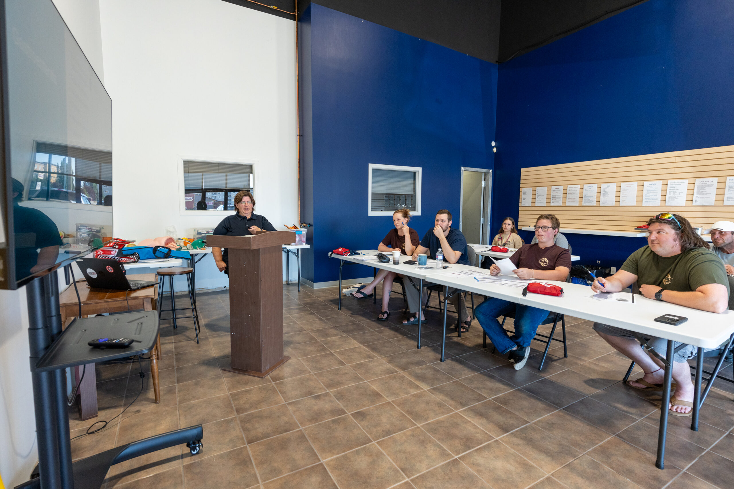 People attending a presentation in a classroom.