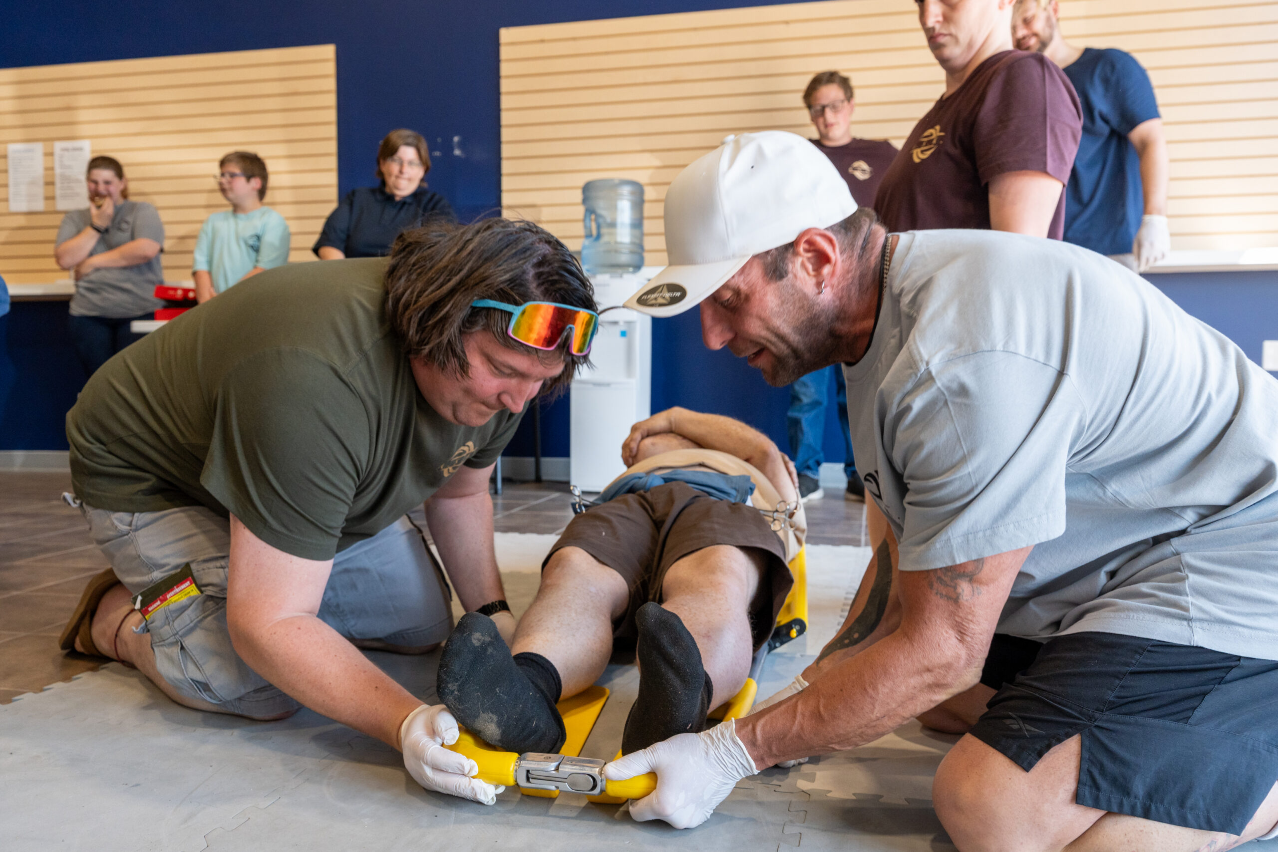 First responders practicing emergency medical techniques.